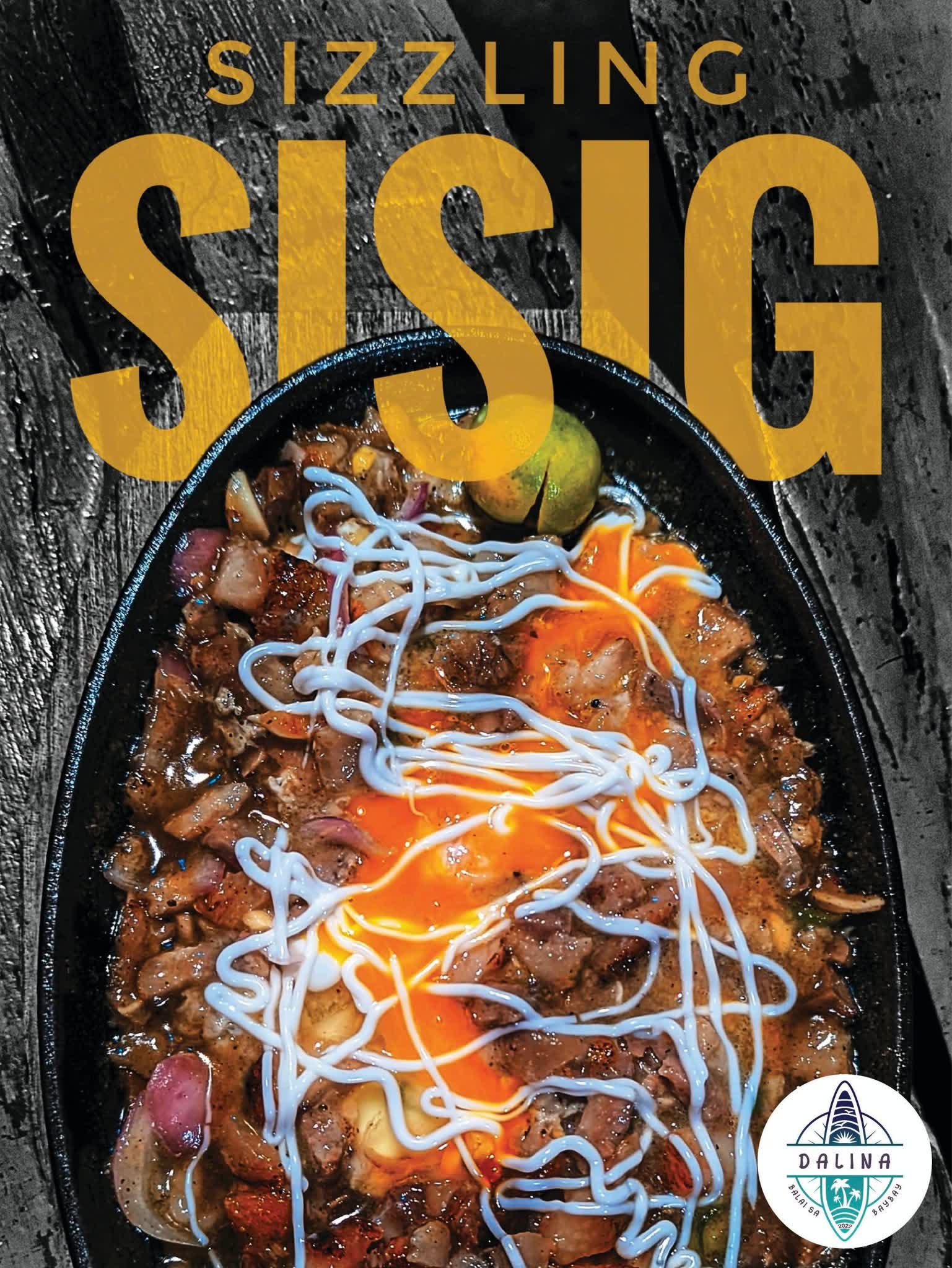 Sizzling Sisig on a hot plate topped with an egg